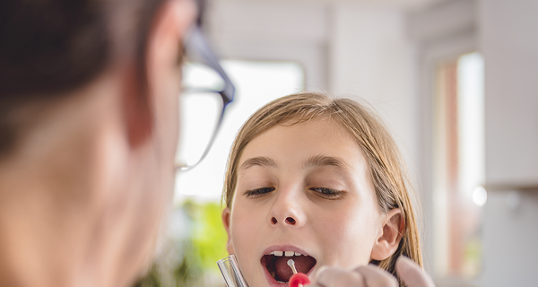Female doctor take sample from young girl patients