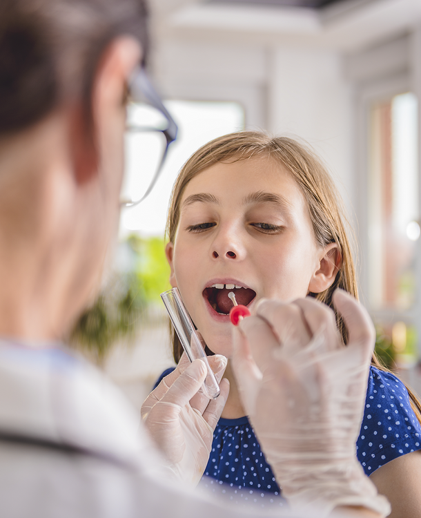 Female doctor take sample from young girl patients